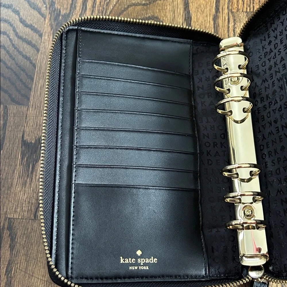 Black leather Kate Spade Wellesley zip around personal organizer/planner